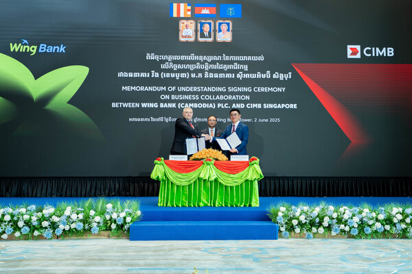 clockwise, dr. dmytro kolechko, ceo of wing bank, neak oknha kith meng, chairman of the board of directors of wing bank and ceo of the royal group of companies, and victor lee meng teck, ceo of cimb singapore and ceo of growth markets, are posing for a photo during the mou signing ceremony. (prnewsfoto/wing bank (cambodia) plc)